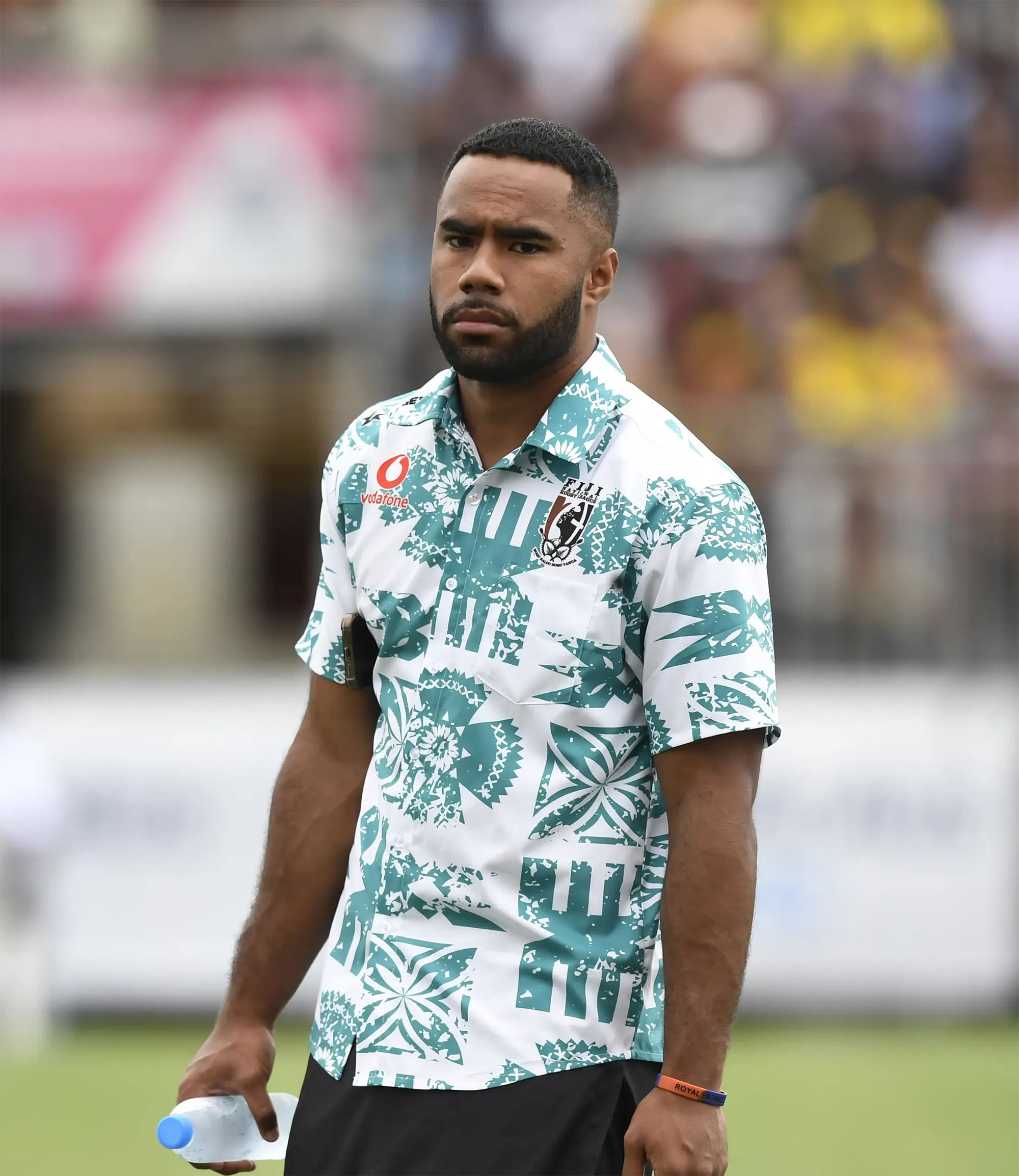 Fiji Bati Player wearing custom button up shirt with Fiji Bati branding.
